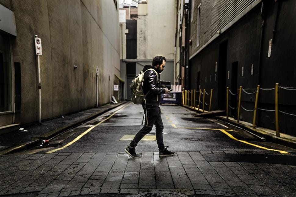 A man standing in an alley